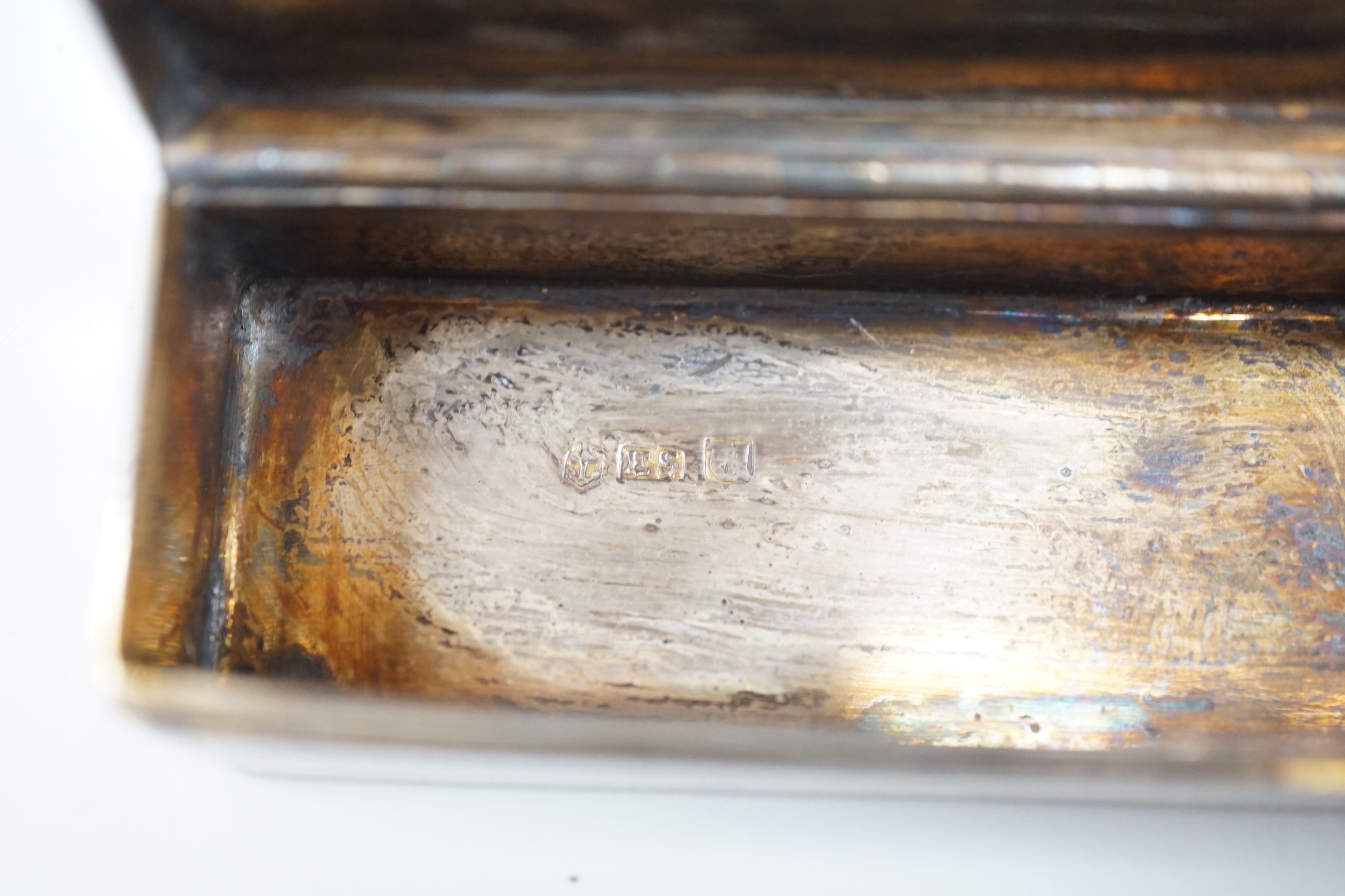 An early Victorian engine turned silver rectangular snuff box, Edward Smith, Birmingham, 1843, 77mm, with engraved initials.